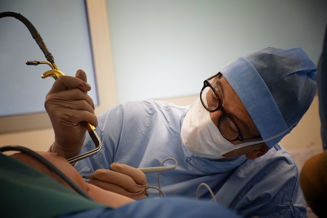 Orthopedic surgeon preparing hispatient for TKR operation